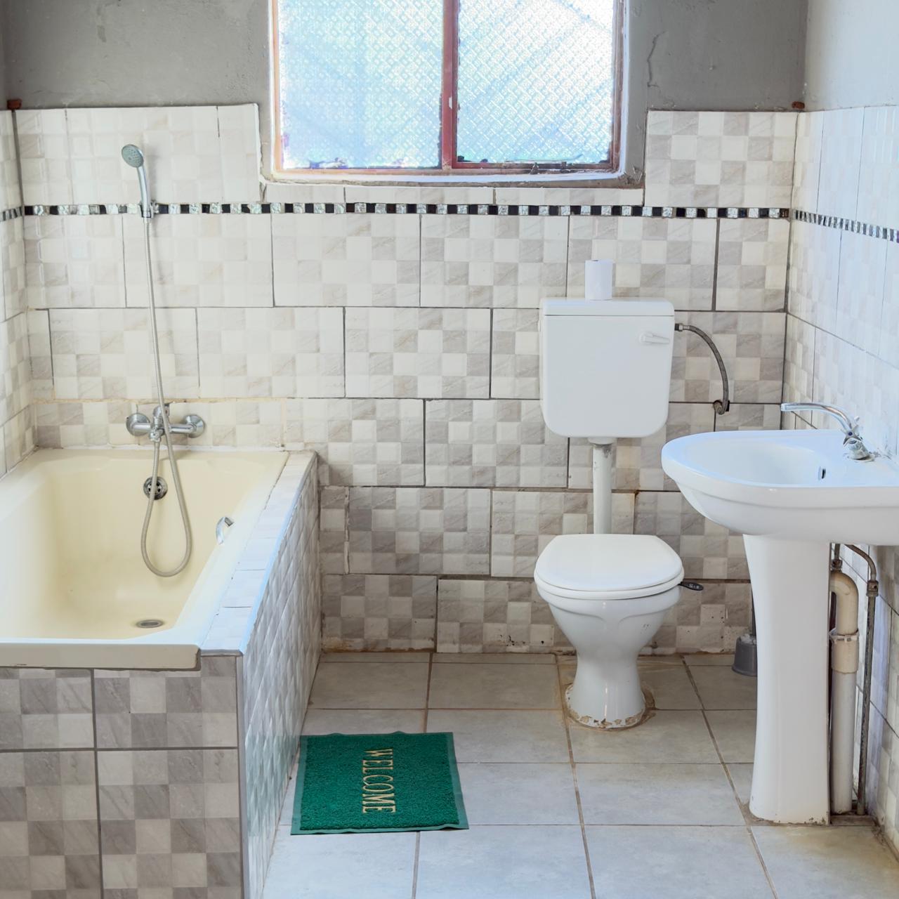 Private bathroom at Godmill City Guesthouse in Taung