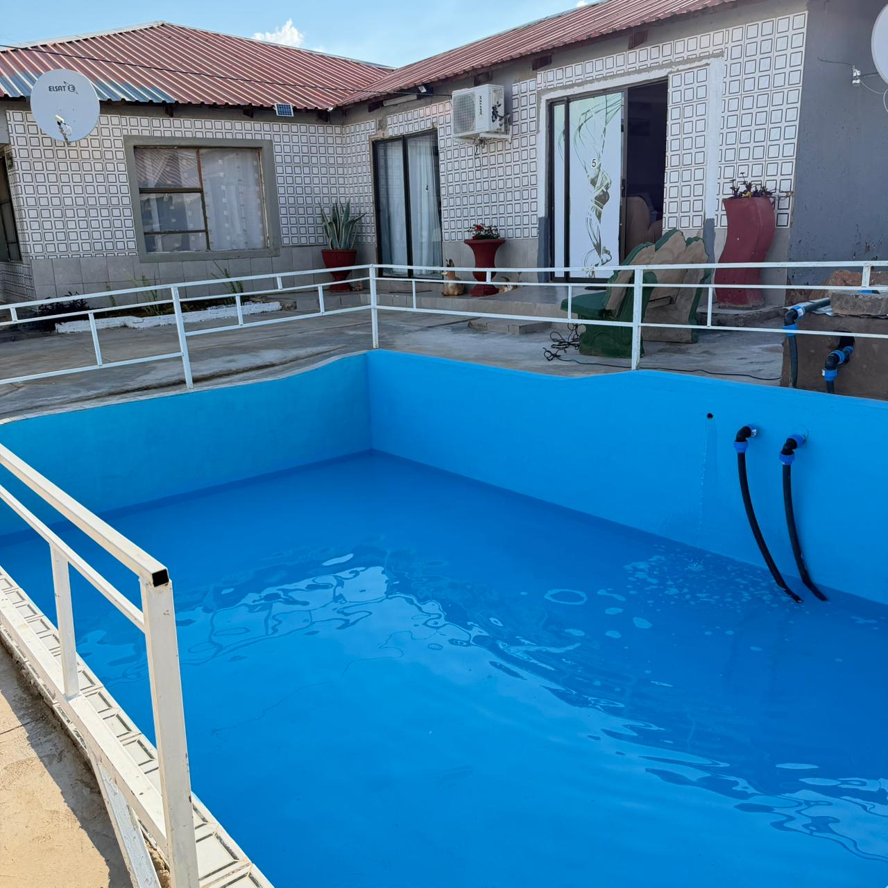 Swimming pool at Godmill City Guesthouse in Taung